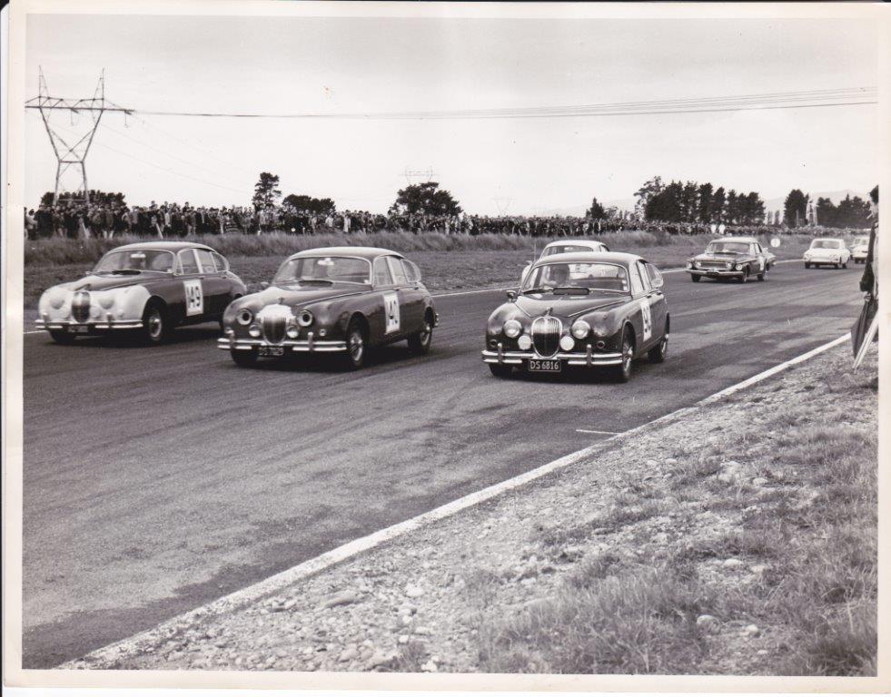 Name:  ernie racing a jag.jpg
Views: 2528
Size:  122.6 KB