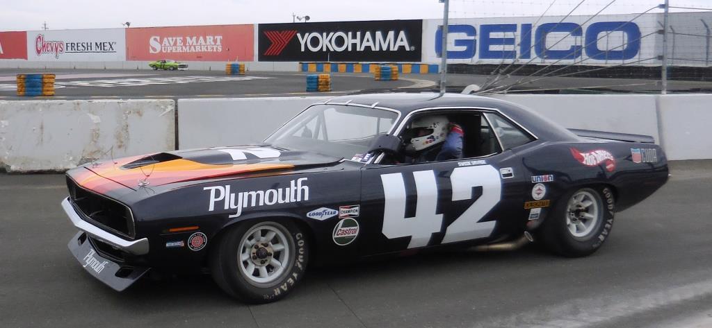 Name:  1970 Plymouth Cuda # 42 being driven back to the pits by Bill Ockerlund.JPG
Views: 504
Size:  130.6 KB