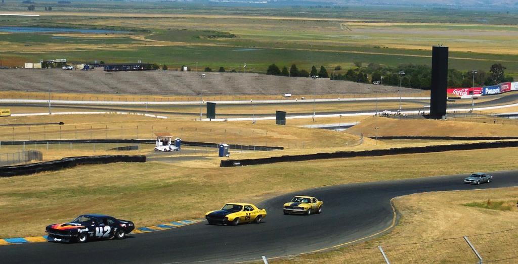 Name:  1970 Plymouth Cuda # 42 leading eventual winner Chad Raynal in Camaro # 64.JPG
Views: 519
Size:  156.2 KB