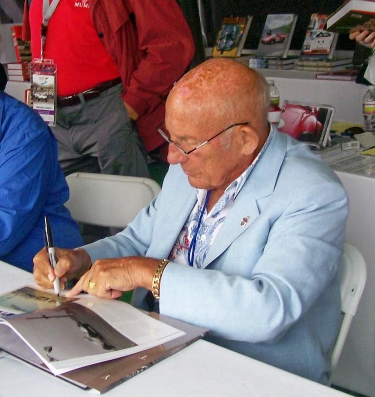 Name:  Stirling Moss signing books. August 2011.jpg
Views: 791
Size:  83.7 KB
