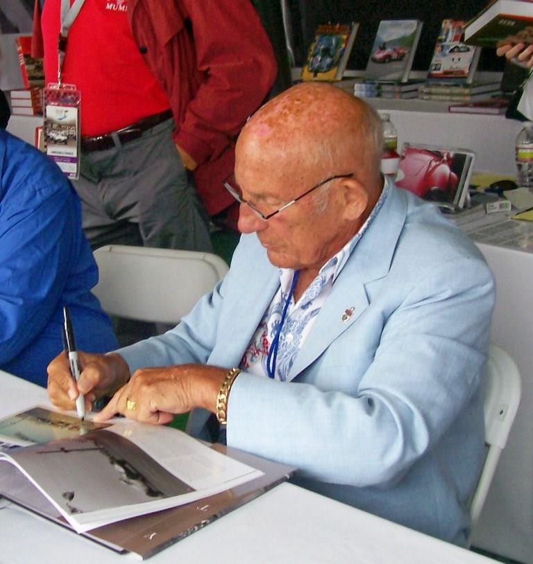 Name:  Stirling Moss signing books. August 2011.jpg
Views: 1020
Size:  83.7 KB