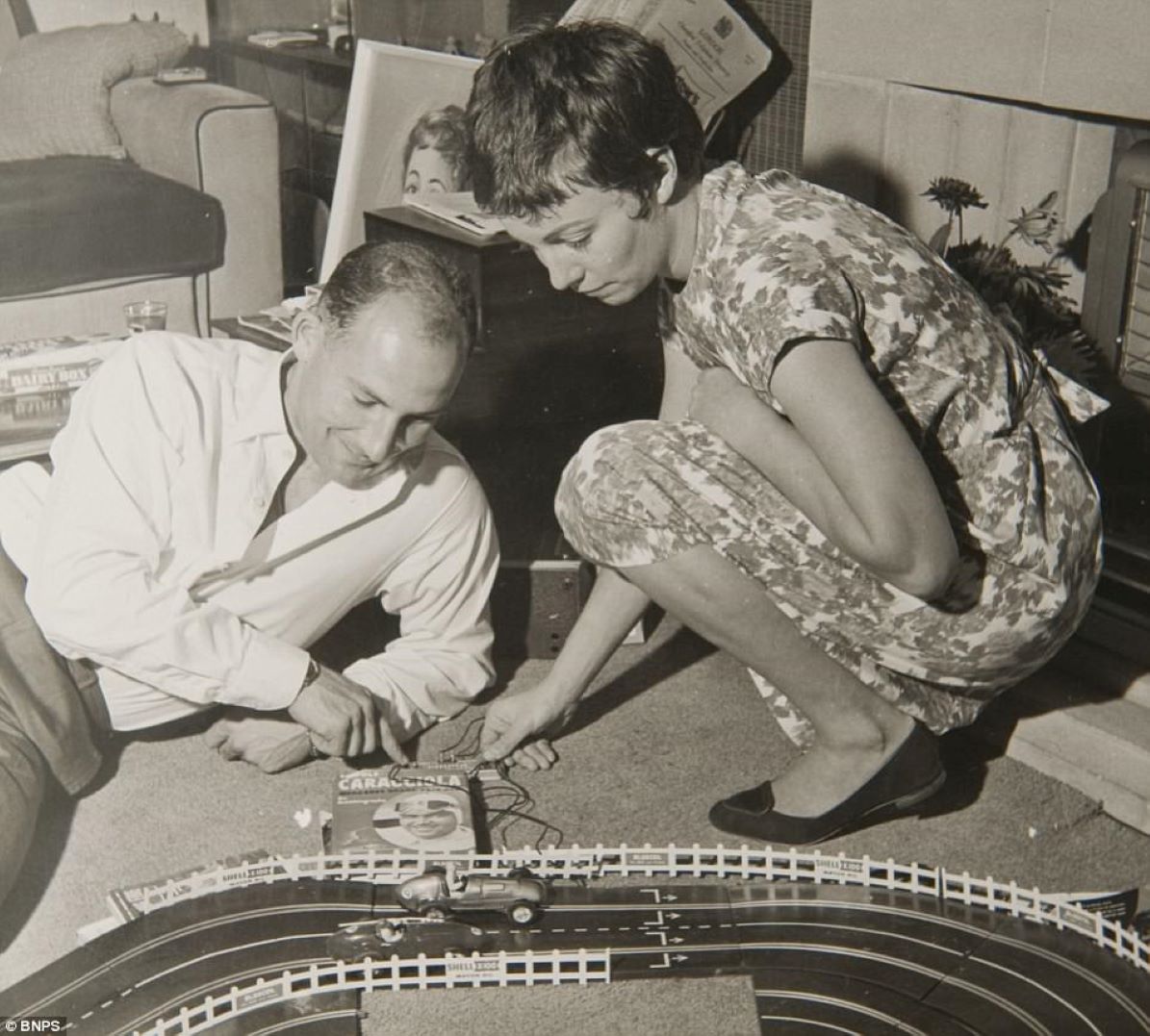 Name:  Model scene #159 Stirling Moss plays Scalextric set with wife Katie his 29th birthday 1958 176kb.jpg
Views: 599
Size:  175.9 KB