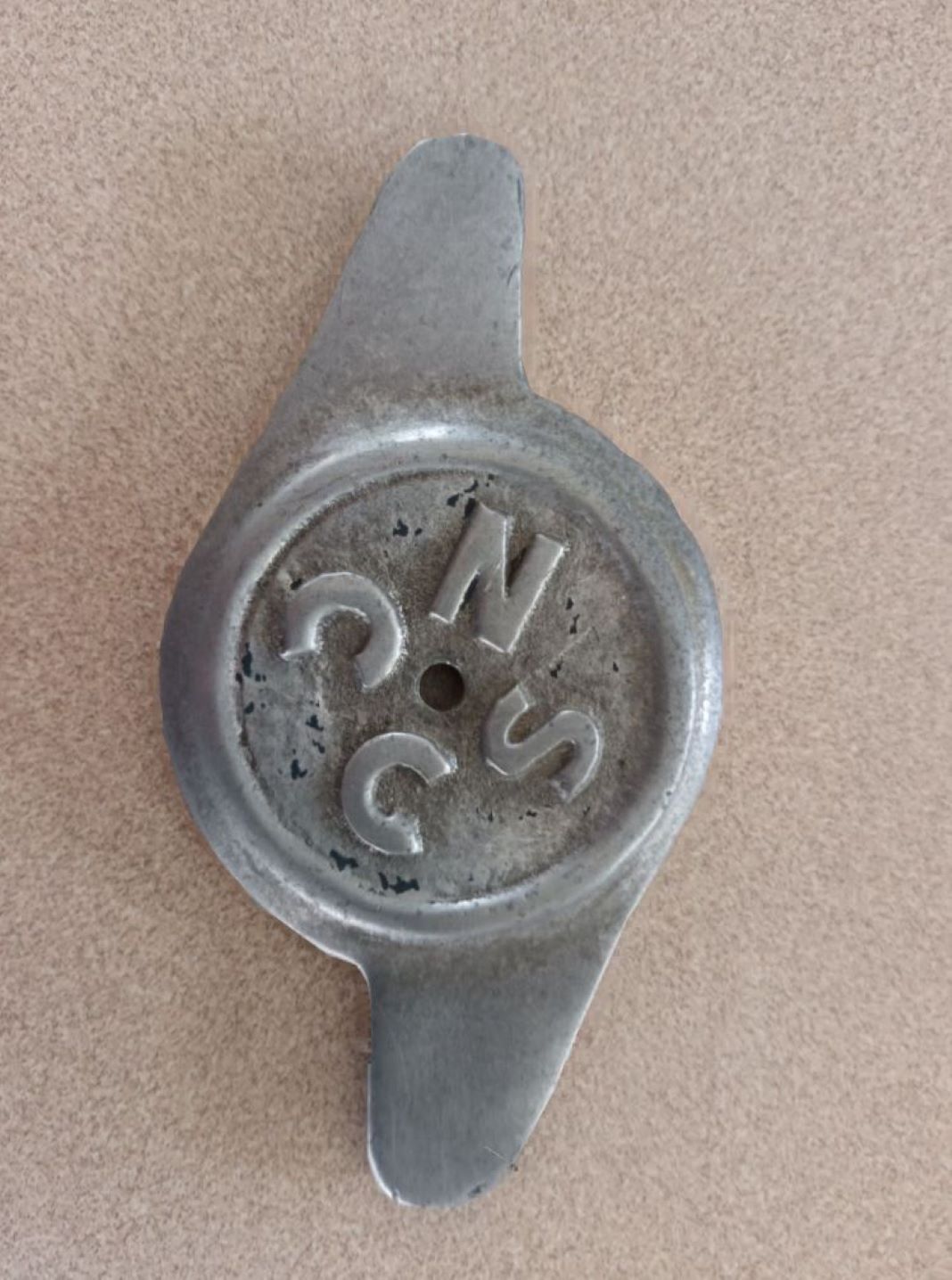Name:  NSCC 1943 #058 NSCC Badge 1950's - Eared Wheel Cap like Wire Wheel Nut rotated - N - 178kb colln.jpg
Views: 10
Size:  181.9 KB